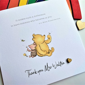 6 x 6 inch Handmade Winnie the Pooh Thank you teacher card. Features a laser cut wooden heart, an AA Milne quote and a classic Winnie the Pooh image. This card is personalised