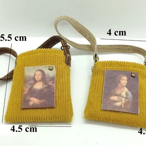 Miniature yellow bag for dolls. Madeof cloth and leather. Bags withh different pictures.
