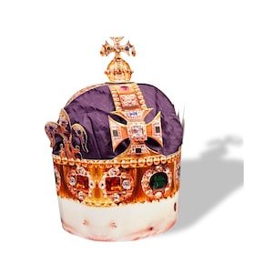 May include: A gold crown with red, green, and blue jewels. The crown has a purple velvet lining and a cross on top.