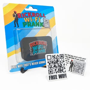 May include: A novelty prank item labelled "Rickroll Wi-Fi Prank." The packaging is blue and yellow with the text "Free Wi-Fi That's Never Gonna." Includes a QR code and a small stand with "Free Wi-Fi" printed on it.