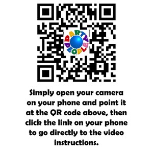 May include: A black and white QR code with a colorful circle in the center. The circle has the words "Party People" written around it in a rainbow of colors. The text below the QR code reads "Simply open your camera on your phone and point it at the QR code above, then click the link on your phone to go directly to the video instructions."