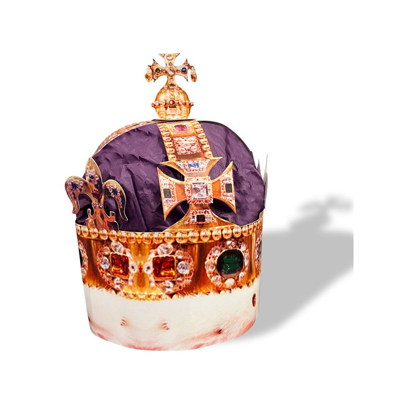 May include: A gold crown with red, green, and blue jewels. The crown has a purple velvet lining and a cross on top.