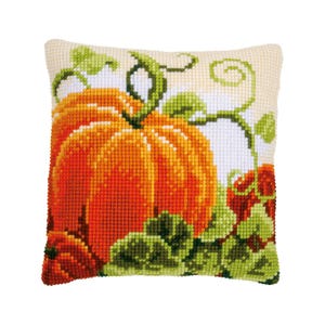 May include: A cross-stitch pillow featuring a large orange pumpkin with green vines and leaves. The background is a cream color.