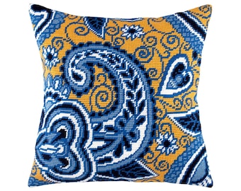 May include: A square needlepoint pillow featuring a vibrant paisley pattern in shades of deep navy blue, light blue, and white, set against a textured mustard yellow background with intricate swirling and floral motifs across the entire surface.
