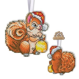 May include: A cross-stitch pattern featuring a cute squirrel wearing a red Santa hat and holding a gold ornament. The pattern is available as a digital download and includes a second design of a squirrel with a red Santa hat and a gold ornament.