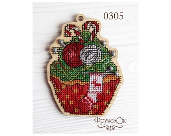 May include: A wooden Christmas ornament shaped like a cupcake with a red and white candy cane, red and white yarn, and a red stocking with a reindeer design. The ornament is decorated with silver beads and the text "0305" is printed on the top.