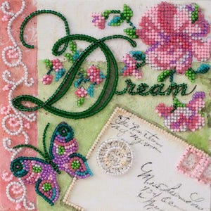 May include: A beaded embroidery art piece featuring the word Dream in green script, surrounded by pink and green floral motifs, a purple and green butterfly, and a vintage-style postcard element with cursive text and a circular postmark.