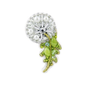 May include: A white and green beaded dandelion brooch with a pearl center and green leaves.