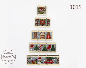 May include: A wooden Christmas tree ornament with five hanging ornaments featuring different Christmas scenes. The ornaments are decorated with red, green, and white embroidery. The top ornament features a wreath, the second a poinsettia, the third a gingerbread house, the fourth a candy cane, and the fifth a snowman.