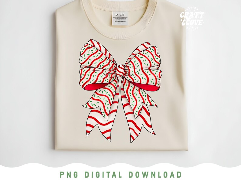 May include: Cream-colored sweatshirt featuring a large, festive bow design. The bow is red with white stripes and green accents, creating a candy cane-like pattern. The words "CRAFT COVE" are in the upper right corner, and "PNG DIGITAL DOWNLOAD" is at the bottom.