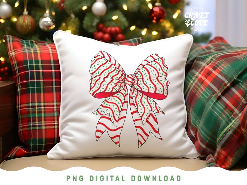 May include: White square pillow with a large red and white bow design. The bow has red stripes and green sprinkles. The pillow is on a couch with plaid pillows and a Christmas tree in the background. The text "PNG DIGITAL DOWNLOAD" is at the bottom.