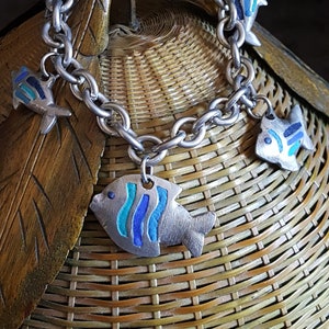 Agatha silver metal and blue enamel fish charm bracelet