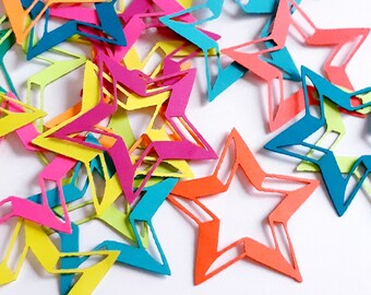 May include: A pile of colorful paper stars in various shades of pink, orange, yellow, green, and blue. The stars are cut out of paper and have a simple, geometric design.