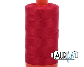 May include: A spool of red thread with an orange plastic bobbin and the text "Aurifil" in blue.