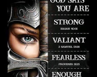 May include: Digital art featuring a warrior's eye with a teal iris, half-covered by a sword and helmet. Text reads "GOD SAYS YOU ARE STRONG, VALIANT, FEARLESS, ENOUGH" with Bible verses. The background is black.