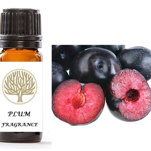 May include: A small amber glass bottle with a black cap, labeled "PLUM FRAGRANCE". The bottle is next to a group of plums, some whole and some cut in half, revealing their red flesh.