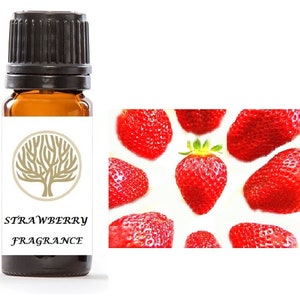 May include: A small amber glass bottle with a black cap, labeled "STRAWBERRY FRAGRANCE". The bottle is surrounded by a white background with red strawberries.