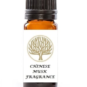 May include: A small amber glass bottle with a black screw-on cap. The bottle has a white label with a gold tree logo and the text "CHINESE MUSK FRAGRANCE".
