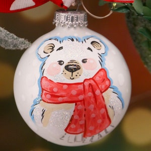 Polar Bear Wearing and Polka Dot Scarf. Hand Painted on white glass Christmas ball.