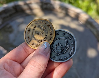 Moneda de juego de rol de rana