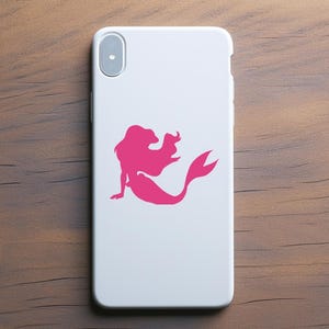 May include: A white phone case with a pink silhouette of a mermaid with flowing hair and a tail.