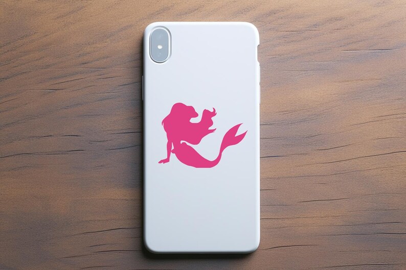 May include: A white phone case with a pink silhouette of a mermaid with flowing hair and a tail.