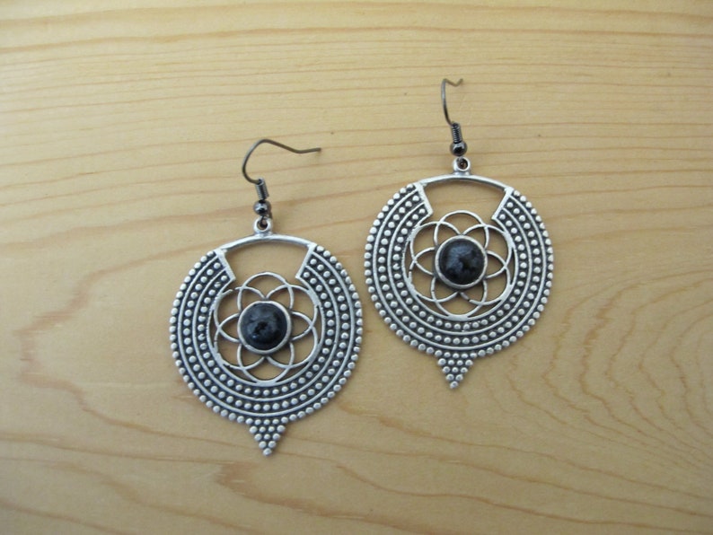 Gunmetal fishhook earrings 2 12 inch drop. Patterned metal earrings with handmade black 8mm resin and ink bead