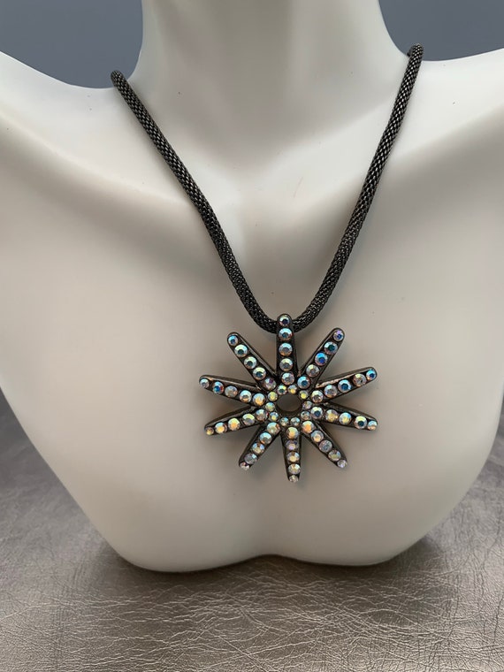 The Radiant Petra Pendant Necklace wows with pinecone art and crystals. –  Holly Yashi
