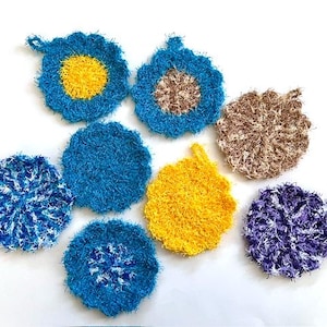 May include: A white ceramic mug with a black handle and the text "But First, Coffee" in a black, bold font. The mug is on a white surface.