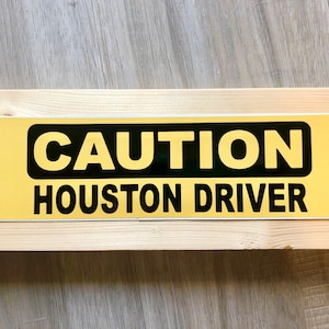 Caution Houston Driver Bumper Sticker