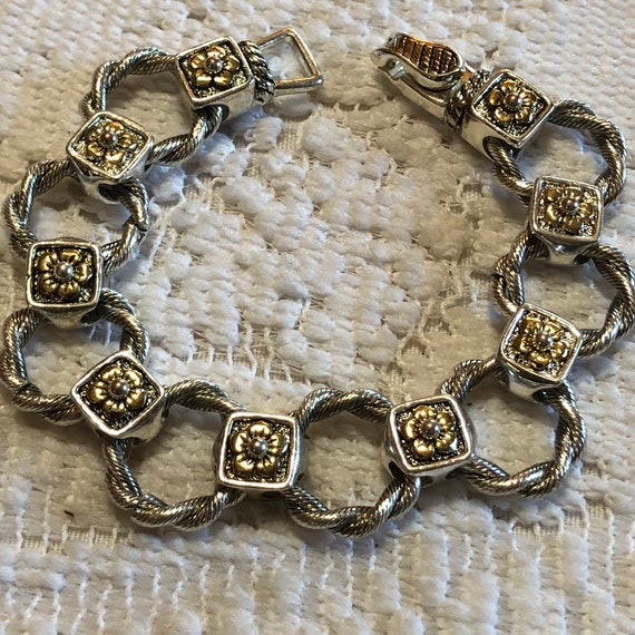 Silver tone and gold tone bracelet