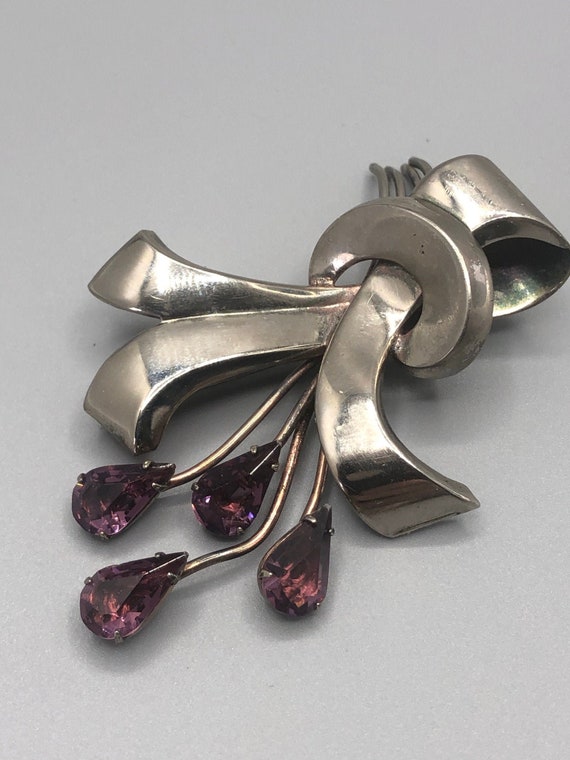 Sterling brooch with glass amethyst color stones - image 1