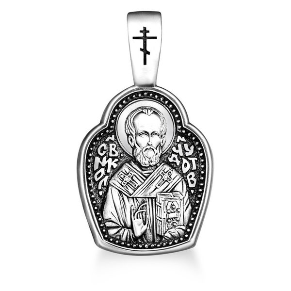 Silver pendant depicting St. Nicholas the Wonderworker with a prayer