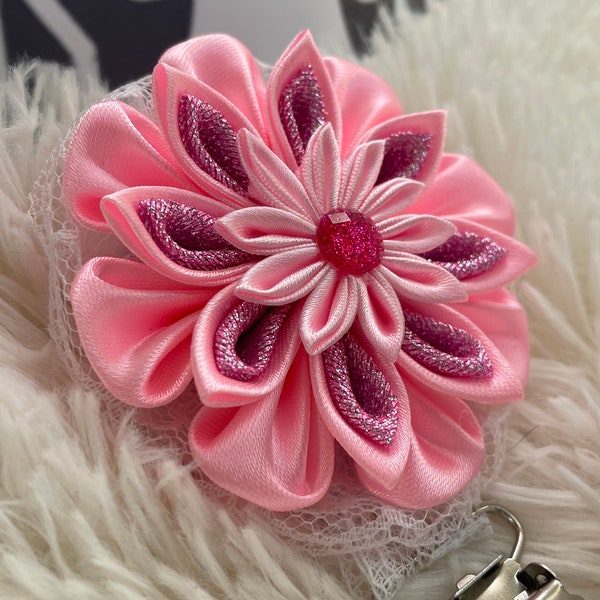 Folded ribbon style flower with different shades of pink ribbon, centre piece, Dog Show exhibitor number ring clip with pinback finishing