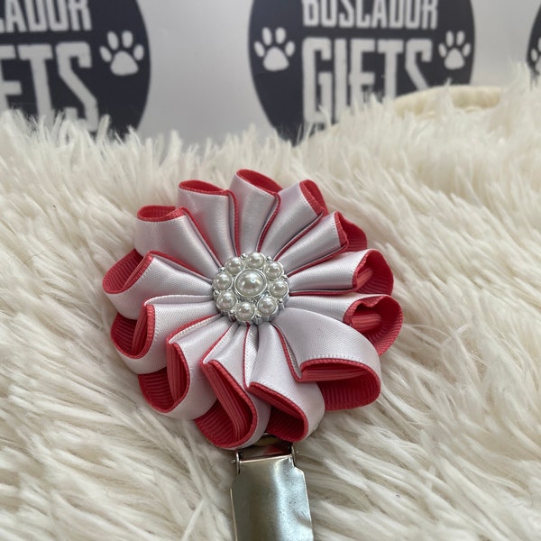 Folded rosette style flower made with salmon and white  ribbon, centre piece, Dog Show exhibitor number ring clip with pinback finishing