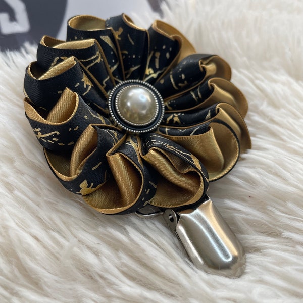 Folded ribbon style rosette with black and gold ribbon, centre piece, Dog Show exhibitor number ring clip with pinback finishing