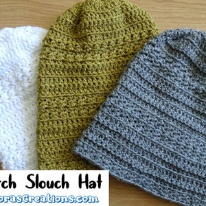 May include: Three crocheted slouch hats in white, olive green, and gray. The hats are made with a textured stitch and are laid out on a wooden surface. "Glover Stitch Slouch Hat" and "www.MeladorasCreations.com" are written below the hats.