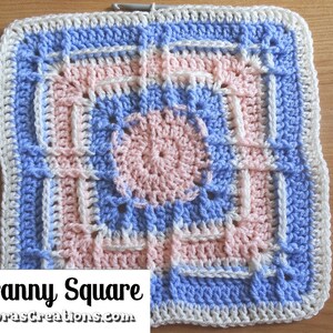 May include: A crochet granny square with a pink, blue, and white color scheme. The square has a central motif and is surrounded by a border. The text "Reverb Granny Square" is visible at the bottom of the image.