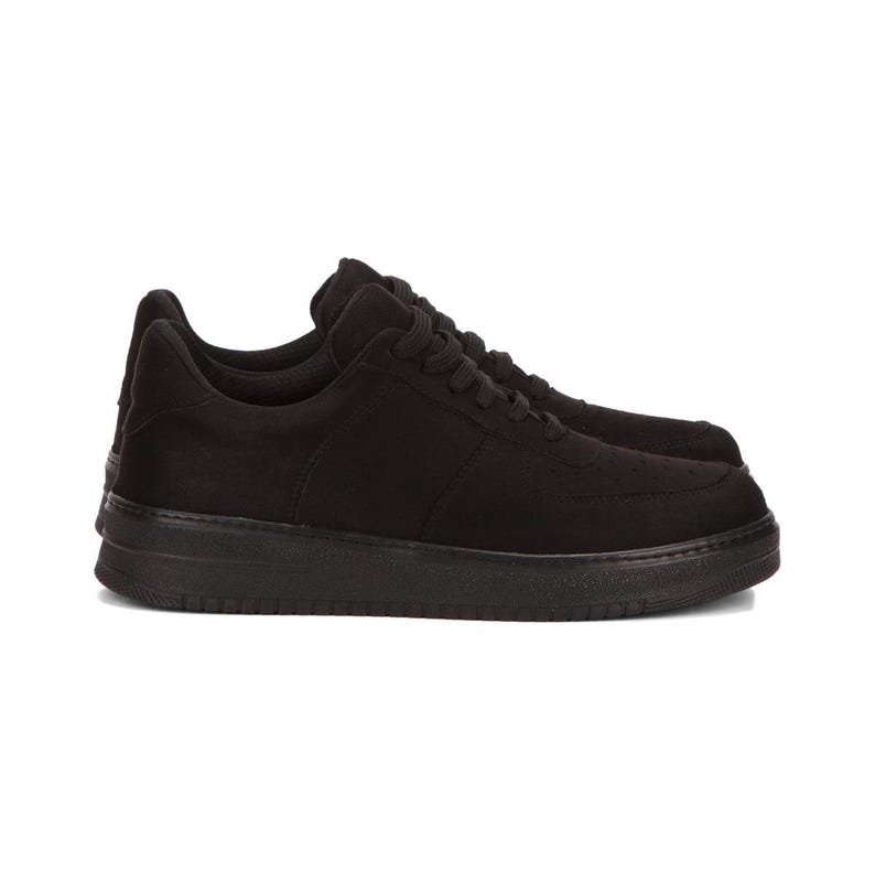 May include: Black low-top sneakers with a lace-up closure and a white rubber sole.