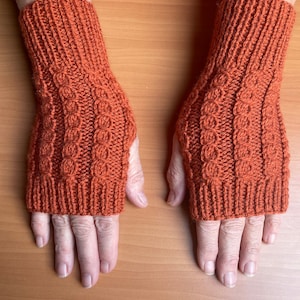 Brick hand knitted mittens