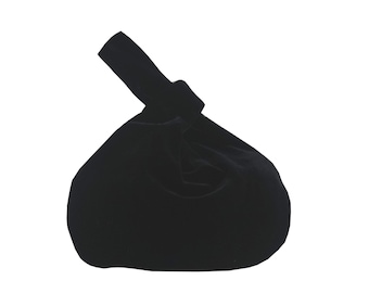May include: A black velvet drawstring bag with a knotted handle.
