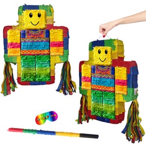 May include: Two colourful piñatas in a blocky figure design, with a smiling yellow face and fringed paper clothing in vibrant hues. A rainbow-coloured eye mask and a striped piñata stick are also present.