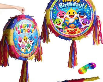 Pignatta di compleanno a forma di squalo con bastone e benda
