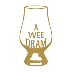 May include: A gold-colored illustration of a whisky glass with the words "A WEE DRAM" in the center. The glass has a tulip shape, with a wide bowl and a narrow mouth, and a sturdy base. The text is in a serif font.