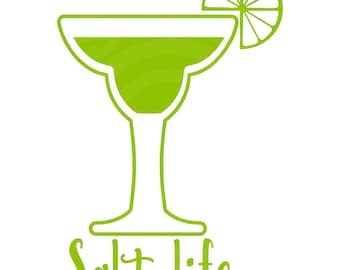 May include: A green margarita glass with a lime wedge, and the words "Salt life" in a playful font. The cocktail glass is filled with a green liquid, suggesting a refreshing drink. The design is simple and clean, perfect for summer.