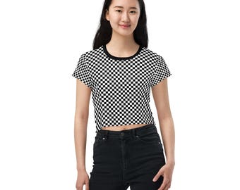 May include: A black and white checkered cropped t-shirt with short sleeves. The shirt is made of a soft, comfortable material and has a relaxed fit.
