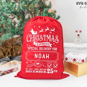 May include: A bright red drawstring gift sack featuring white printed text that reads Christmas Express Special Delivery For Noah, along with a graphic of Santa in a sleigh with reindeer, a North Pole stamp, and the text Do Not Open Before December 25th.