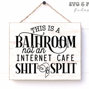 May include: A rectangular white wooden sign with black text that reads THIS IS A BATHROOM not an INTERNET CAFE SHIT & SPLIT, featuring a toilet paper roll graphic. The sign hangs from a brown twine string and includes SVG & PNG files text.