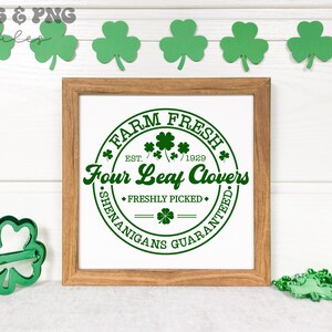 May include: A framed print with a green circle design that says "Farm Fresh Est. 1929 Four Leaf Clovers Freshly Picked Shenanigans Guaranteed".