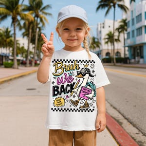 May include: A white t-shirt with the text "Bruh We Back" and a cartoon goose wearing sunglasses and a hat. The goose is holding a pencil and a book that says "Day One Drama". The shirt is worn by a child.